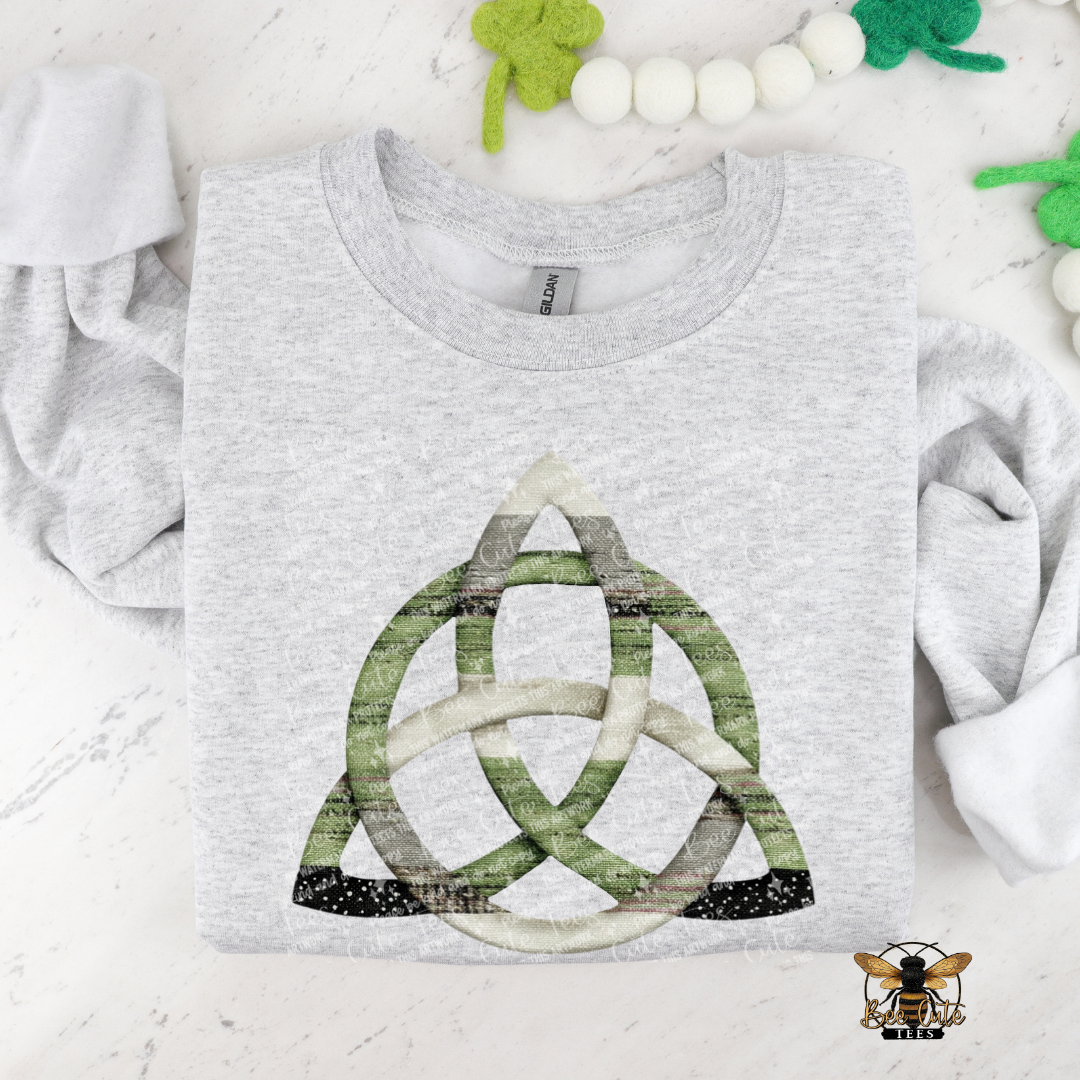 Gray t-shirt with a green and white knot design on a light background