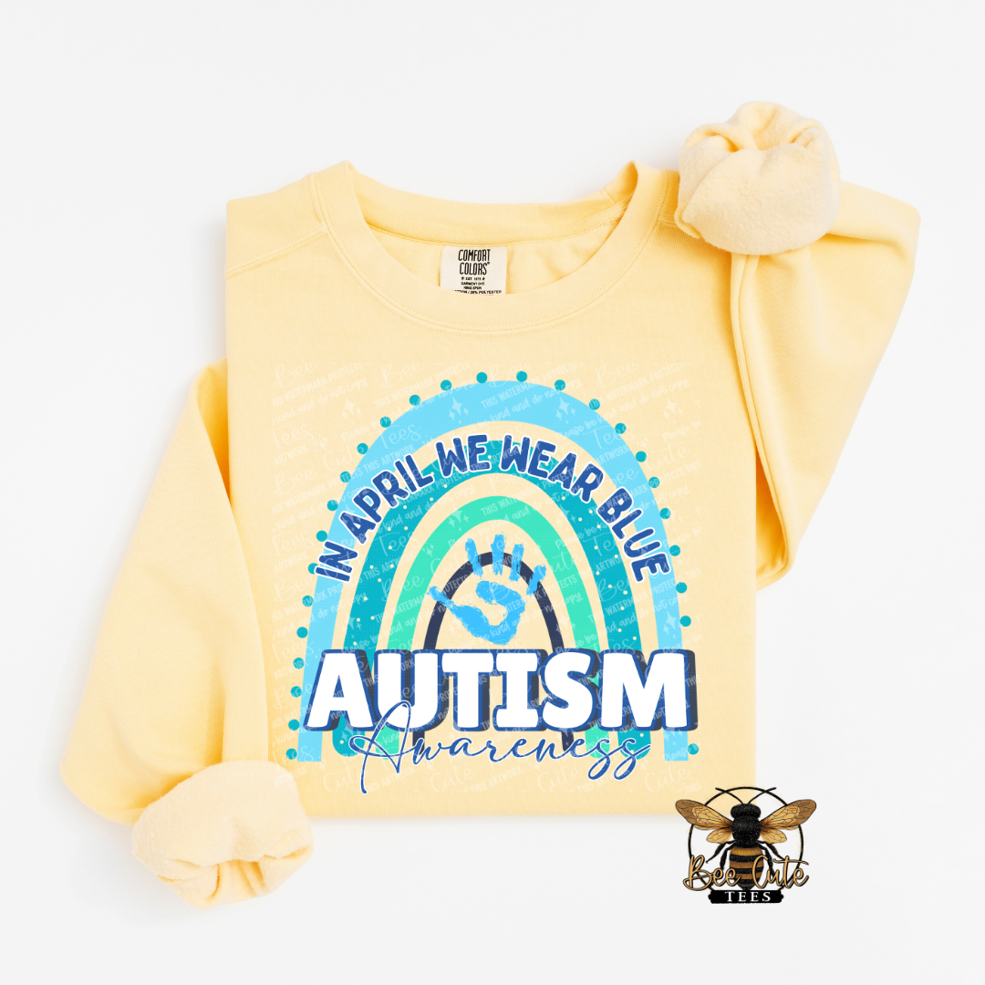 Yellow sweatshirt with autism awareness design on a white background