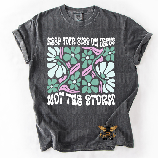 Gray t-shirt with floral design and text on a white background