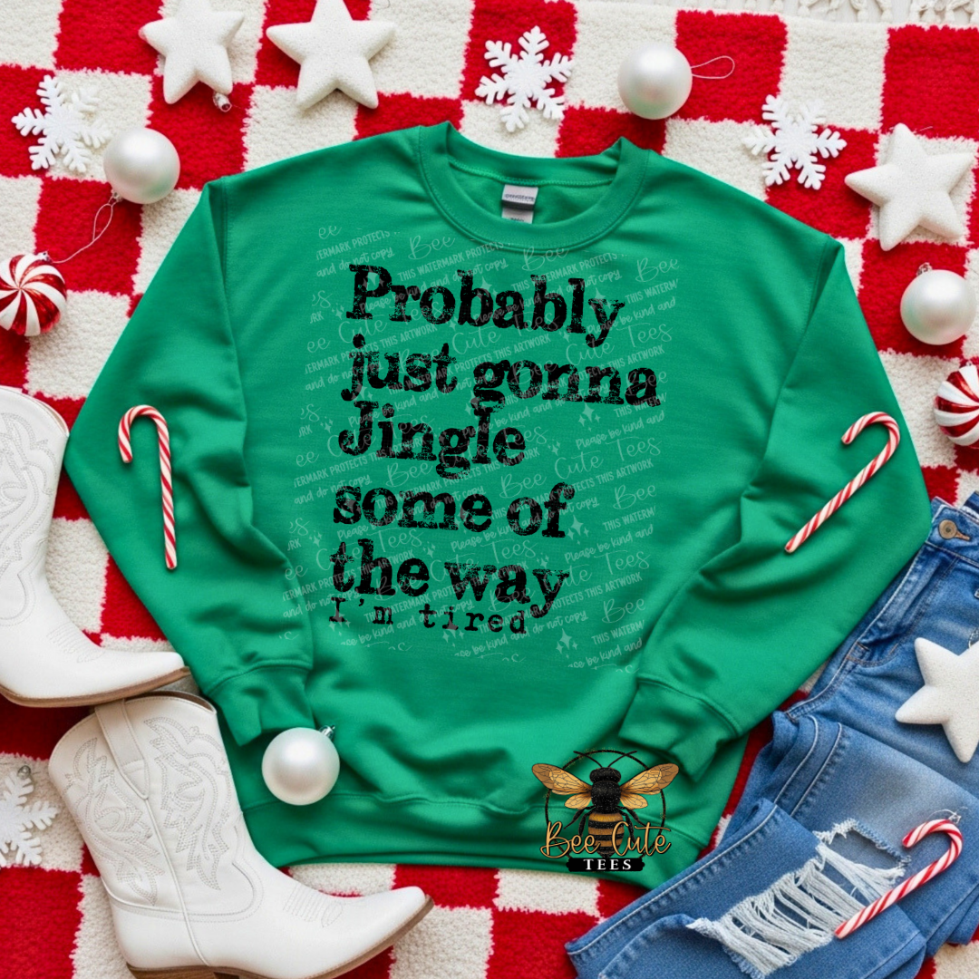 Green sweatshirt with Christmas-themed text on a festive background with candy canes and snowflakes.