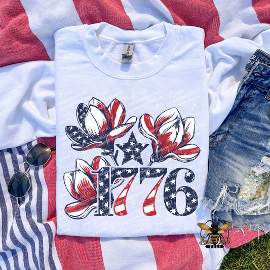 White t-shirt with 1776 design on a flag background