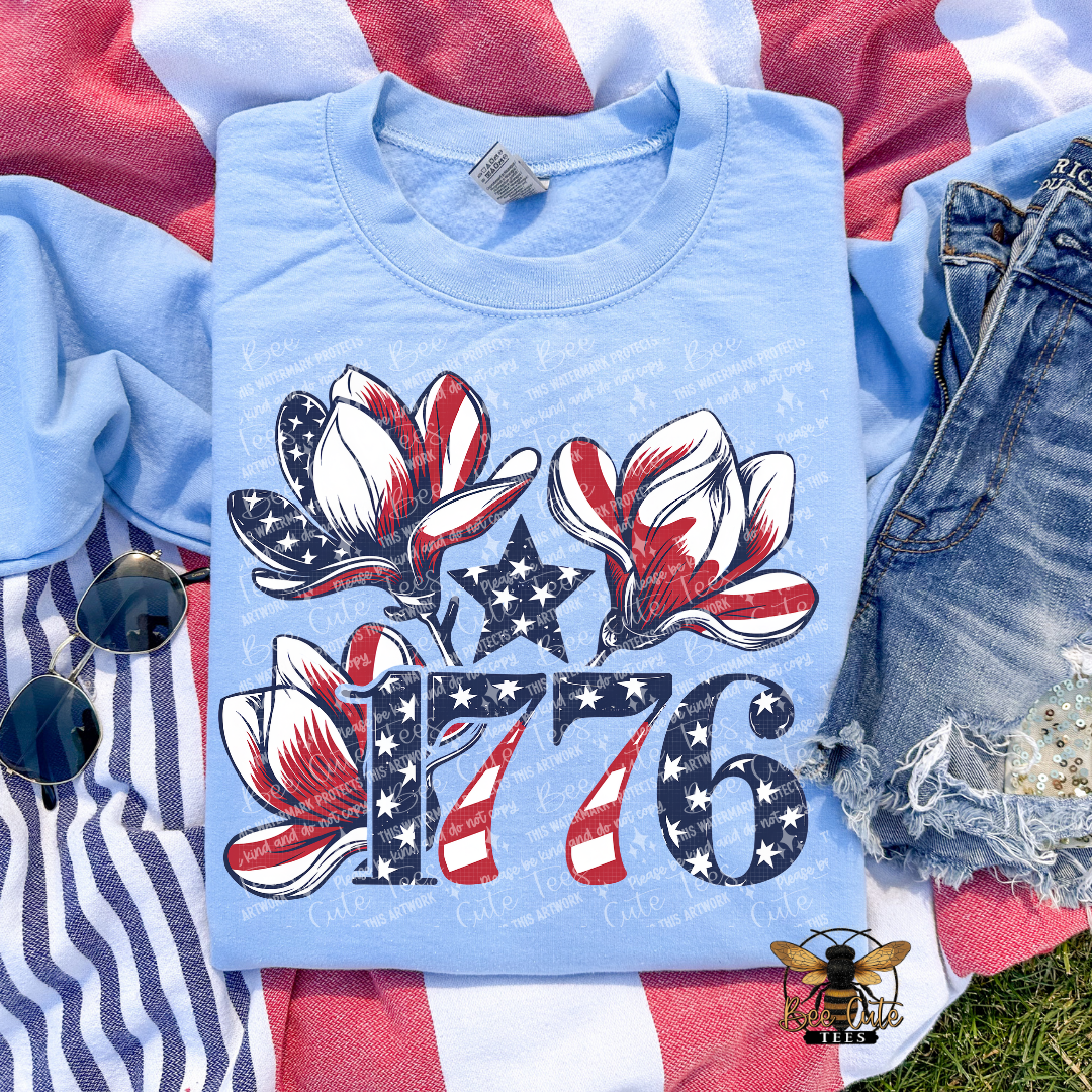 Blue t-shirt with 1776 design on a flag background