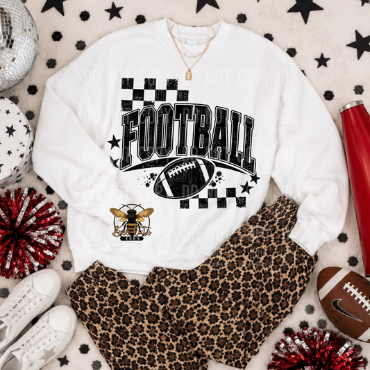 A styled flat-lay outfit featuring a white crewneck sweatshirt with a black and gold football graphic, paired with leopard print pants, white sneakers, and sports props on a patterned background.
