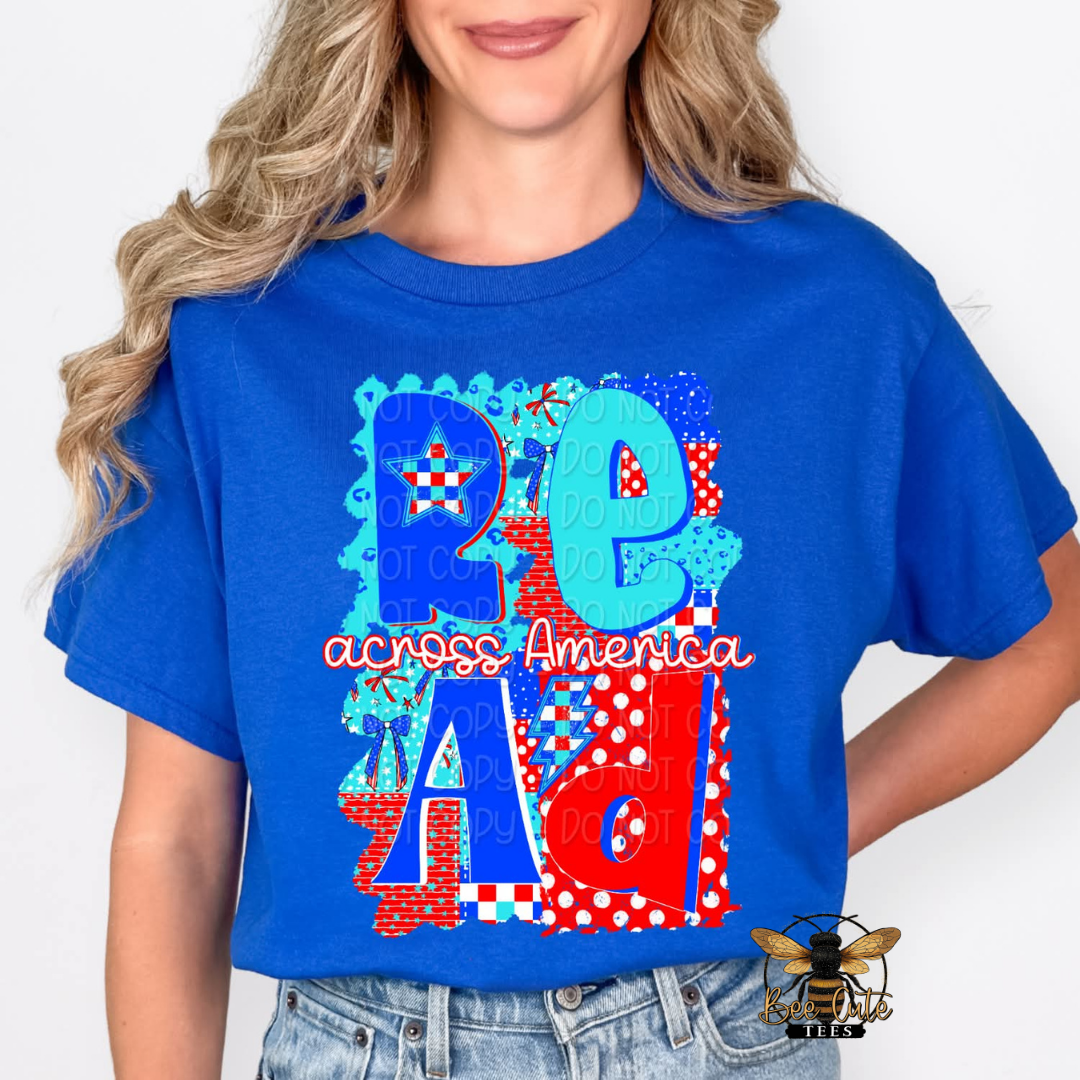 Person wearing a blue t-shirt with colorful text and graphics on a white background