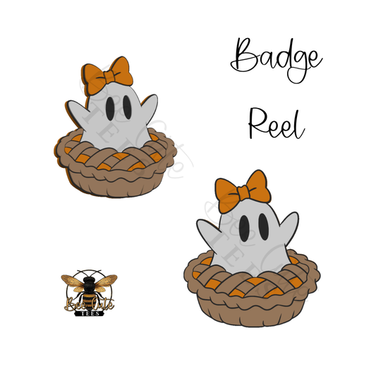 Digital preview of a Halloween badge reel design featuring a cute cartoon ghost in a pie crust with an orange bow, shown twice on a white background with the text 'Badge Reel' and a small bee logo.