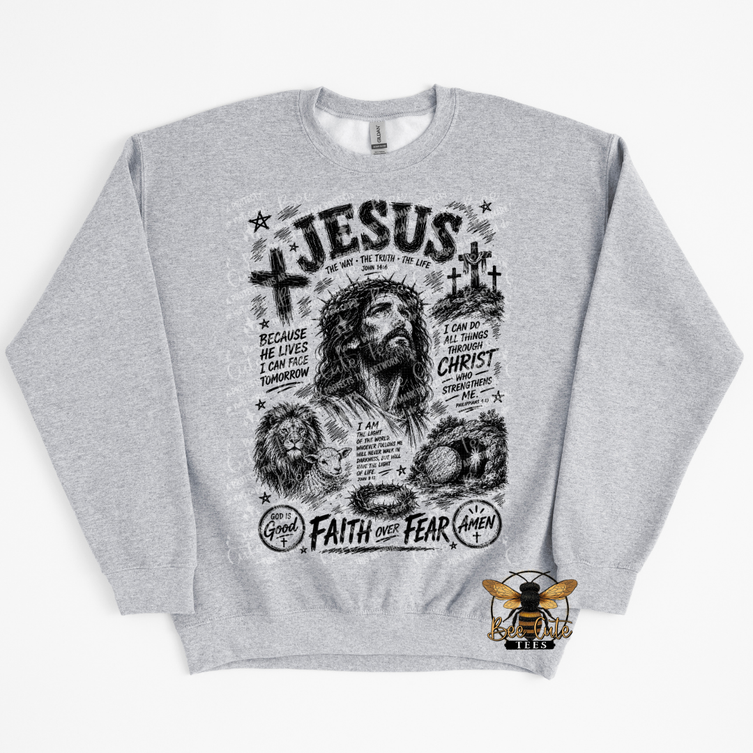 A heather gray crewneck sweatshirt featuring a detailed black graphic print of Jesus Christ with religious text and symbols. 