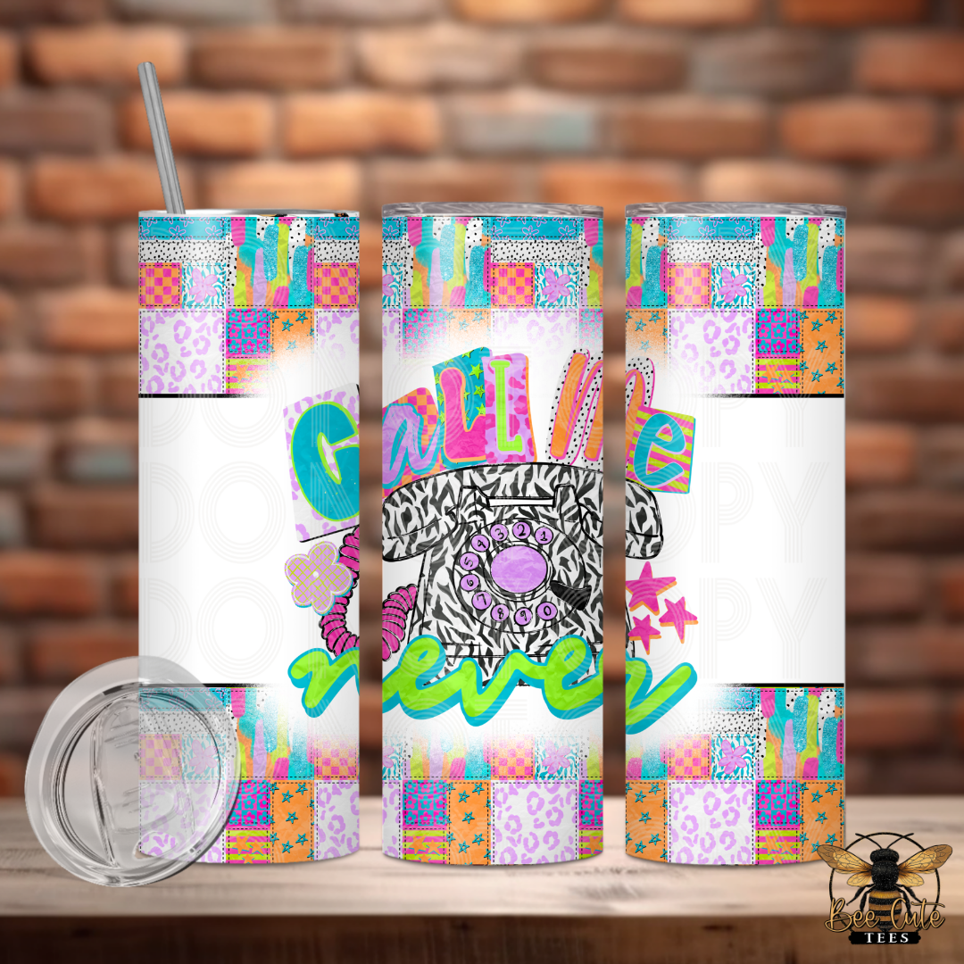 Colorful tumbler with a zebra design and text on a wooden surface with a brick wall background.