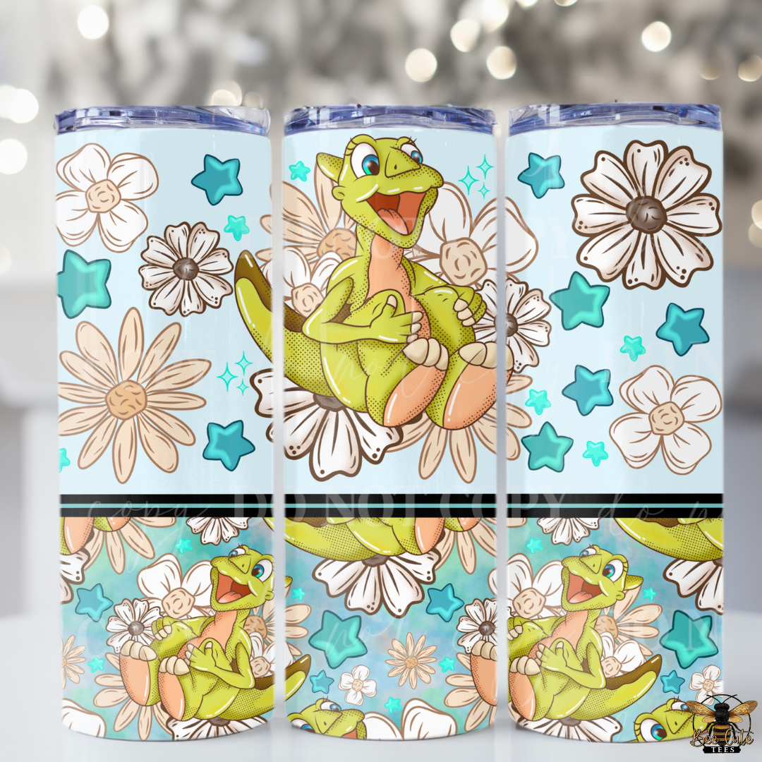 Three tumbler designs featuring a green dinosaur character with flowers and stars on a light blue background.