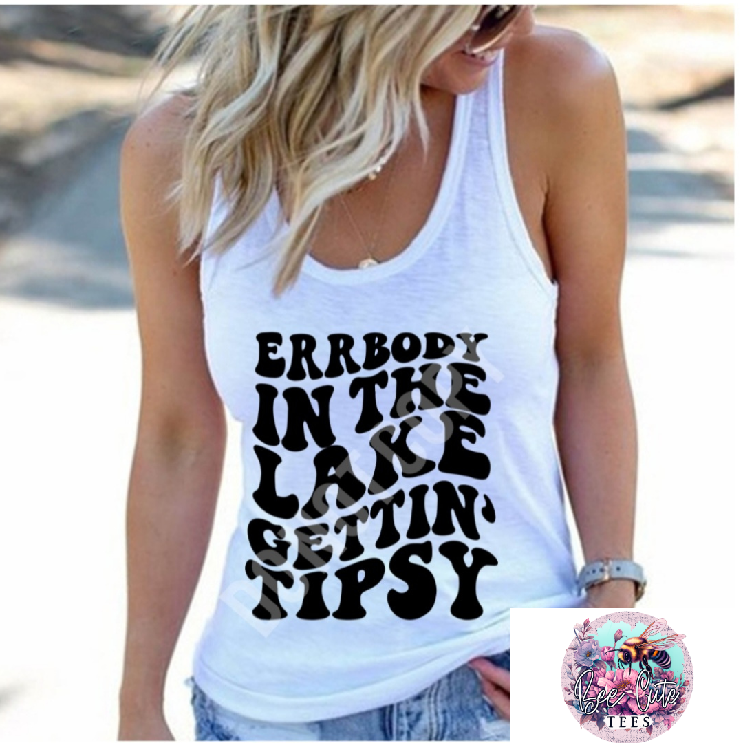 A woman is wearing a white tank top with the text 'ERRBODY IN THE LAKE GETTING TYSI' printed on it.