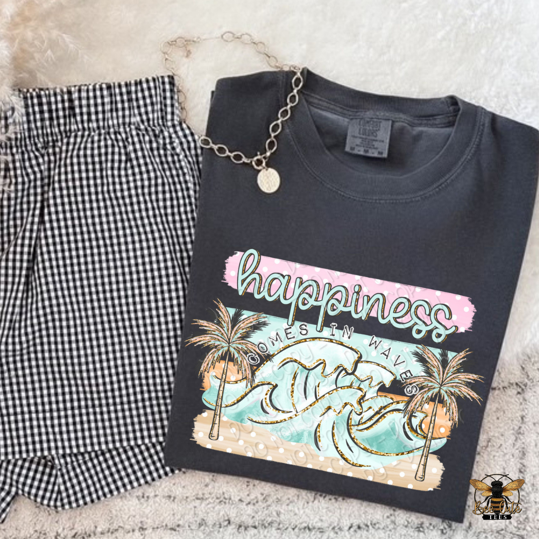 Black t-shirt with a beach-themed design and text, paired with checkered pants on a textured surface.