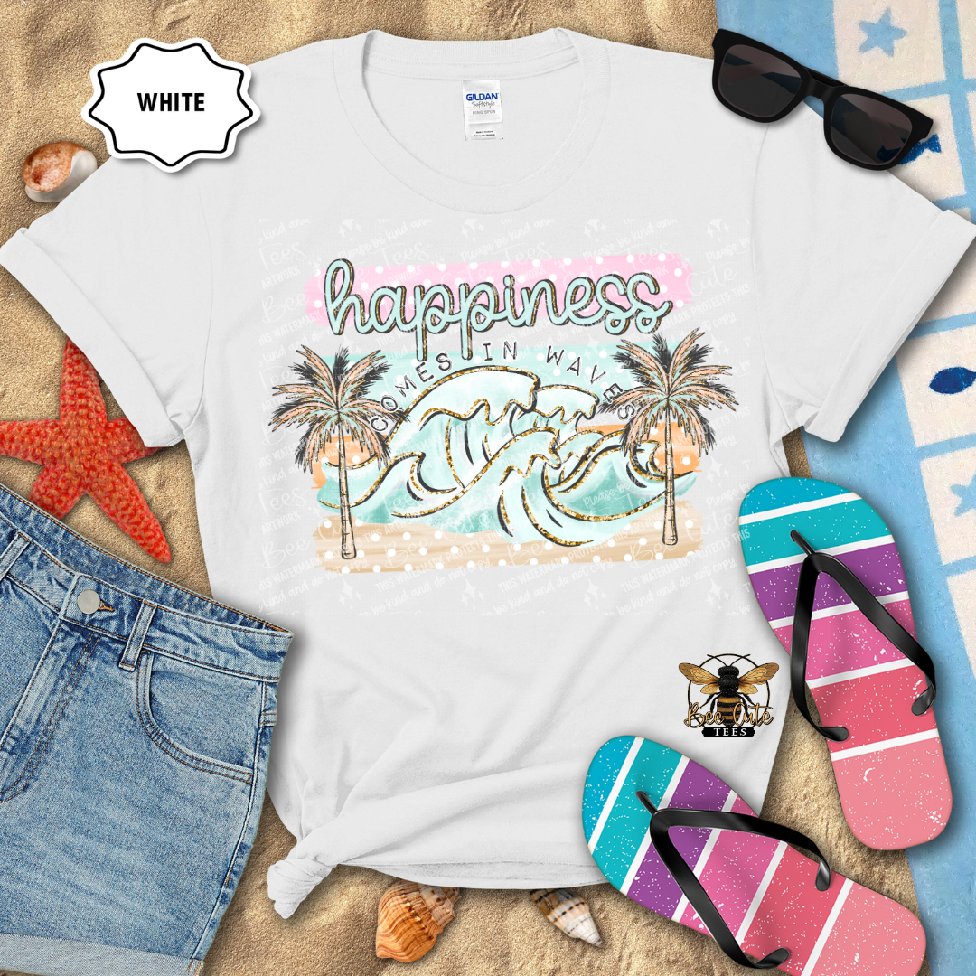 White t-shirt with beach-themed design, sunglasses, flip-flops, and denim shorts on a sandy background.
