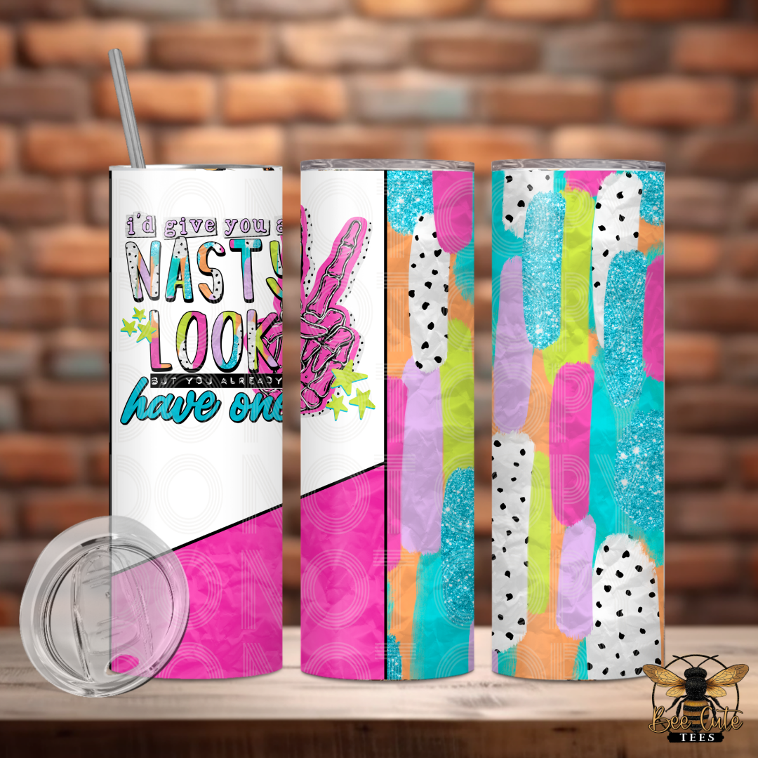 Four colorful tumblers with unique designs on a wooden surface against a brick wall background.