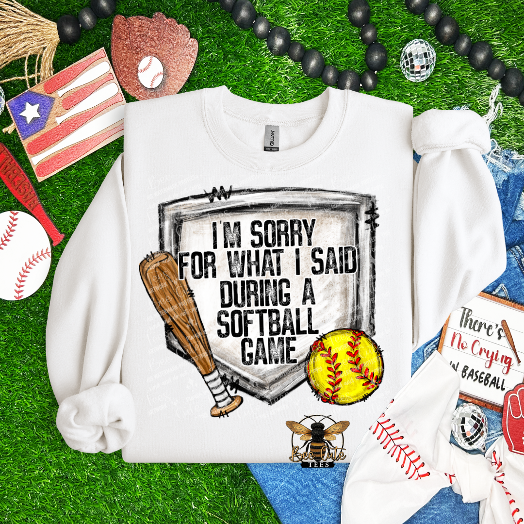 White sweatshirt with sports-themed design on a grass background