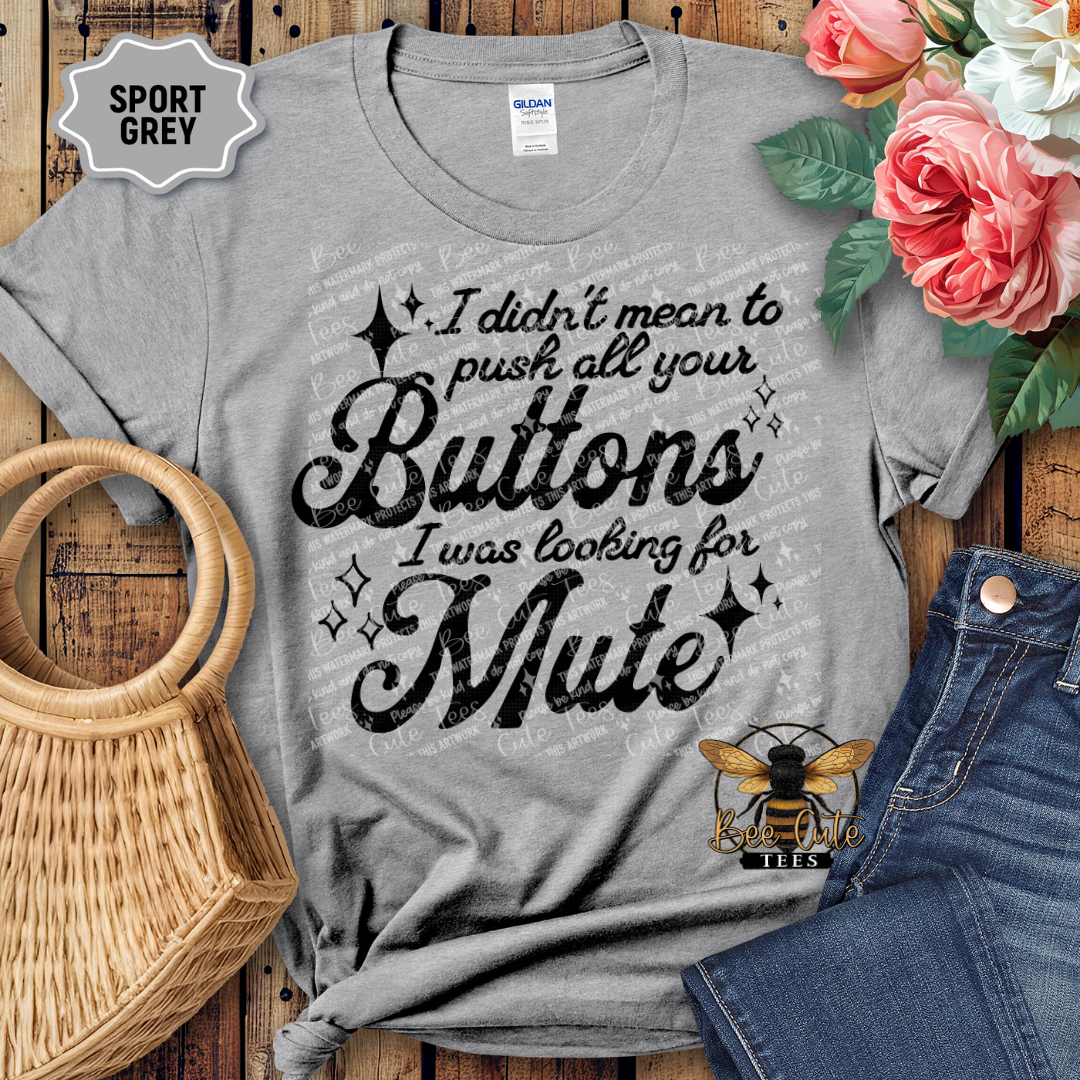 Gray t-shirt with humorous text design on a wooden surface with flowers and jeans.