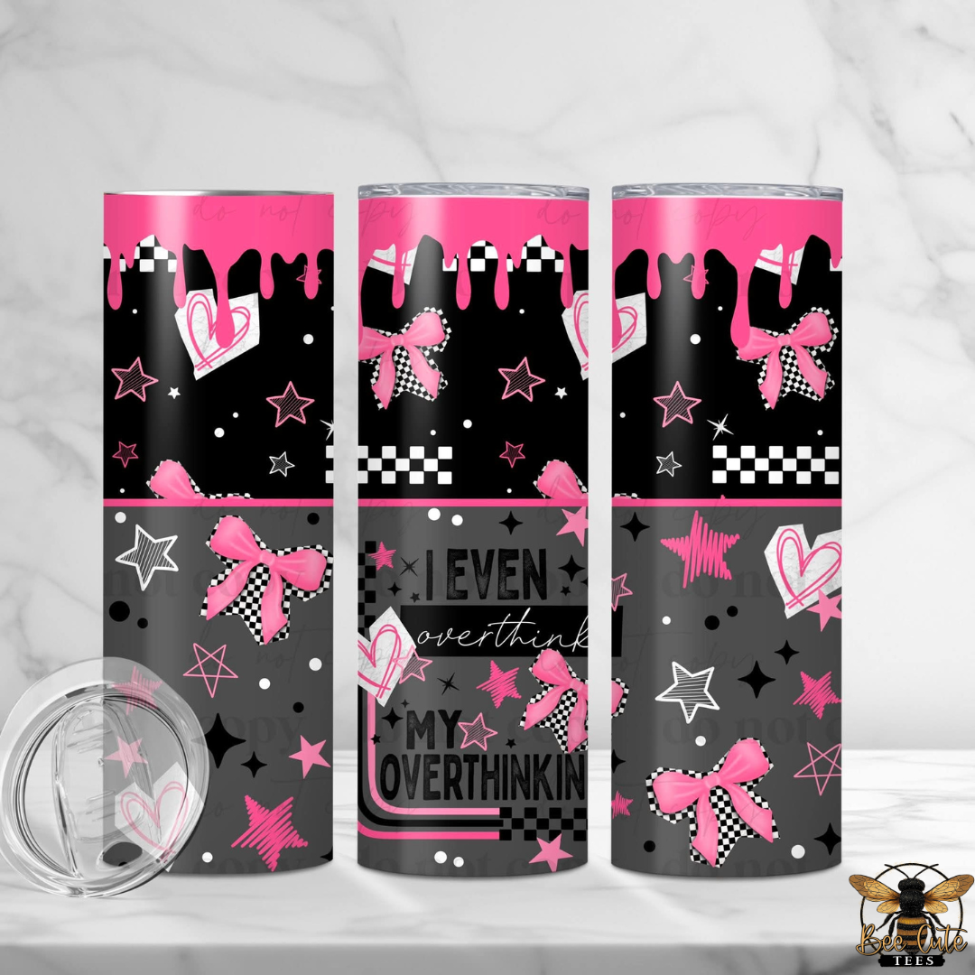 Three tumblers with pink and black designs on a white background