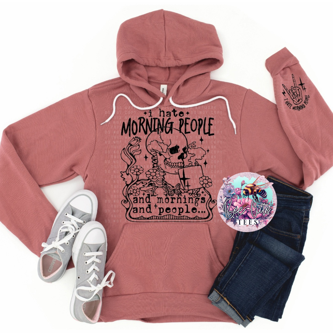 Pink hoodie with graphic design, white sneakers, dark jeans, and a logo on a white background