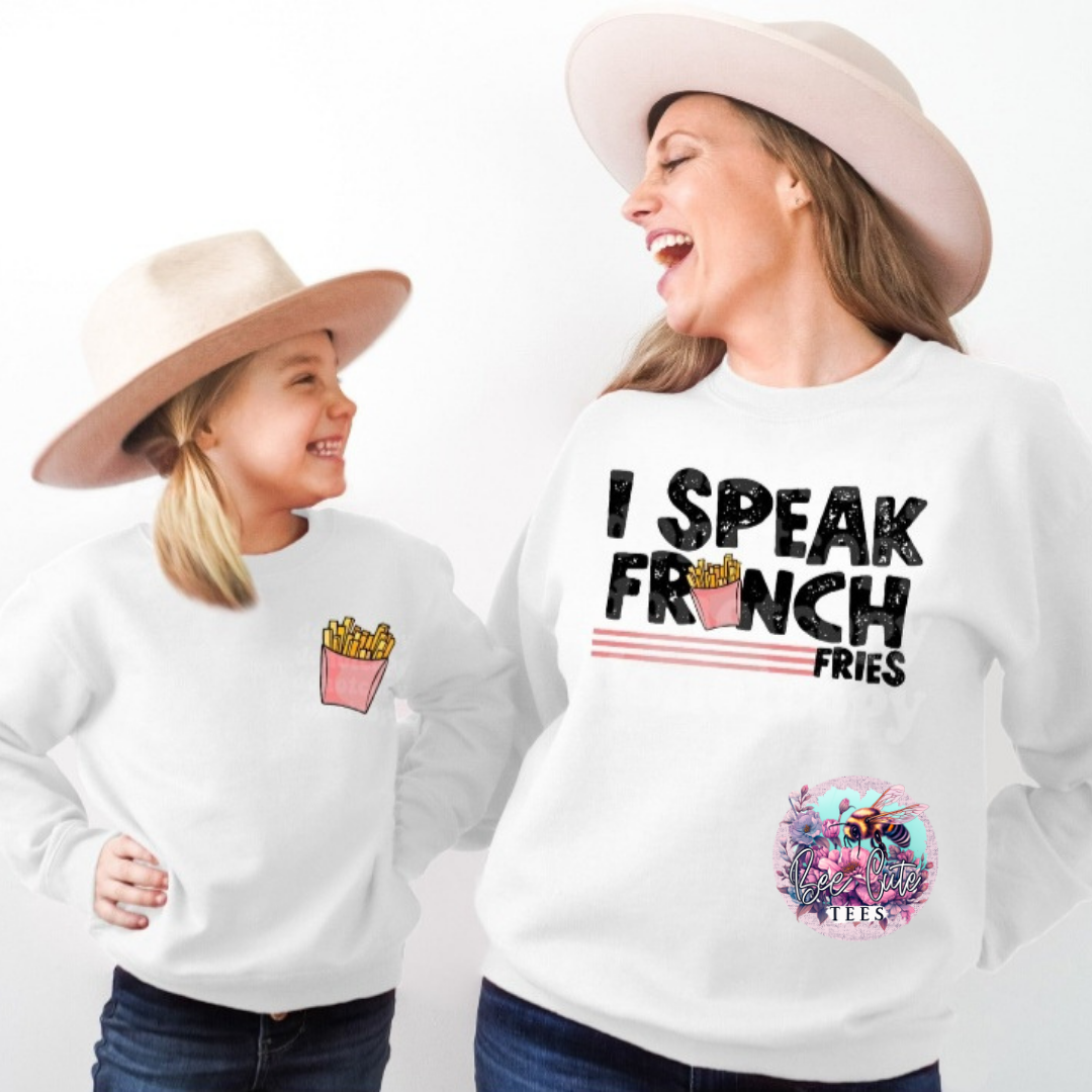 Two people wearing white sweatshirts with unique designs and text.