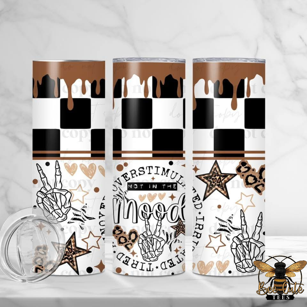 Three tumblers with decorative patterns on a white background