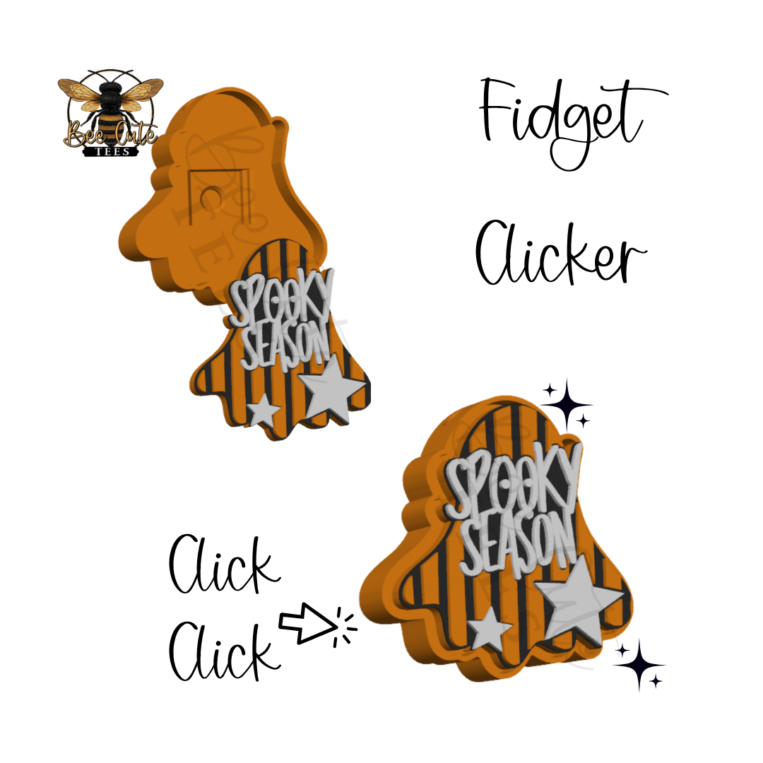 A Halloween-themed fidget clicker shown in two views on a white background. The product is shaped like a ghost with orange-brown wood grain, black vertical stripes, white stars, and 'Spooky Season' text.