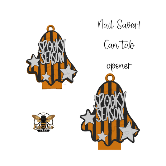 Two Halloween-themed nail savers shown on a white background, each shaped like a ghost with orange and black stripes, white stars, and the words 'SPOOKY SEASON.' One ghost has a small bee charm attached.