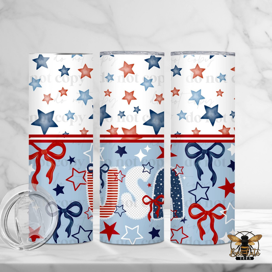 Three tumblers with red, white, and blue star and bow pattern on a white background