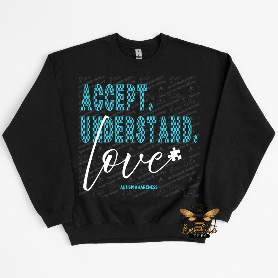 Black sweatshirt with 'Accept, Understand, Love' text on a white background