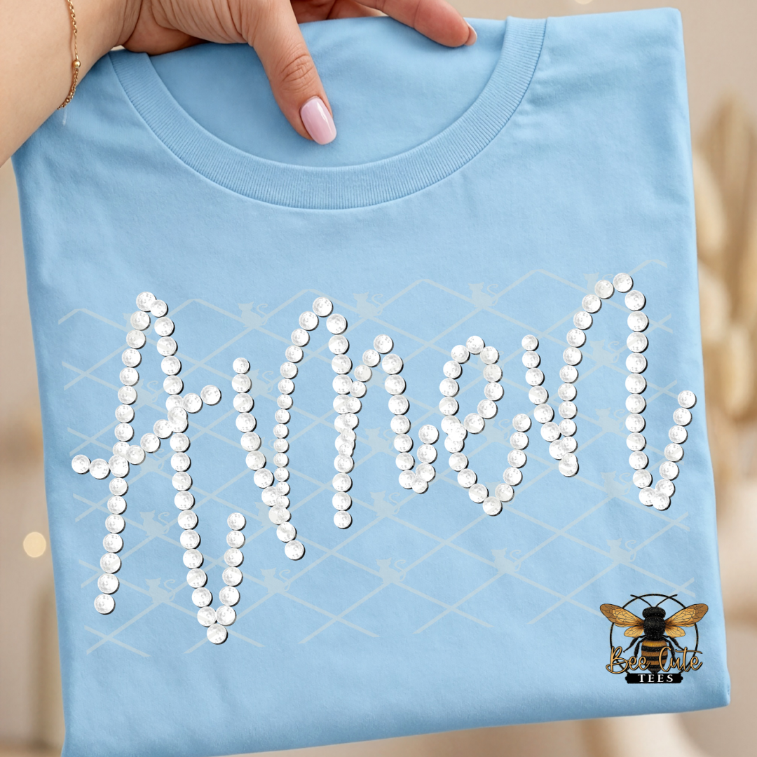 Light blue t-shirt with 'Amen' in faux  white pearls held by a hand.