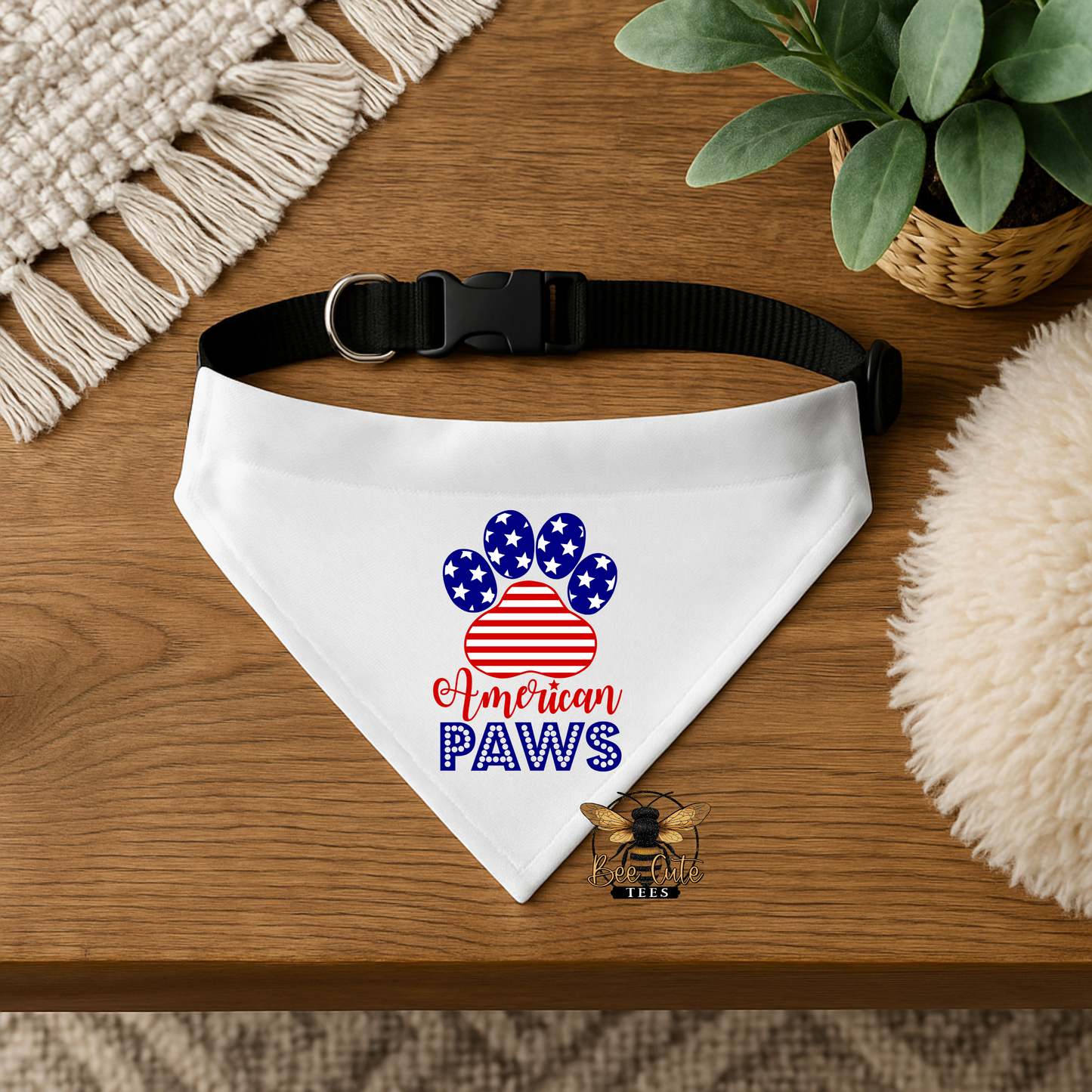 White bandana with 'American Paws' design on a wooden surface