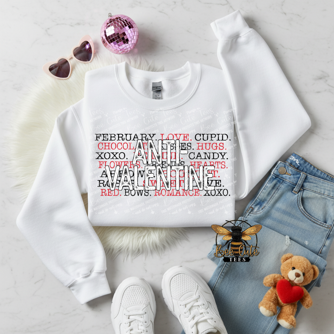 White sweatshirt with Valentine's Day text, surrounded by accessories on a light background