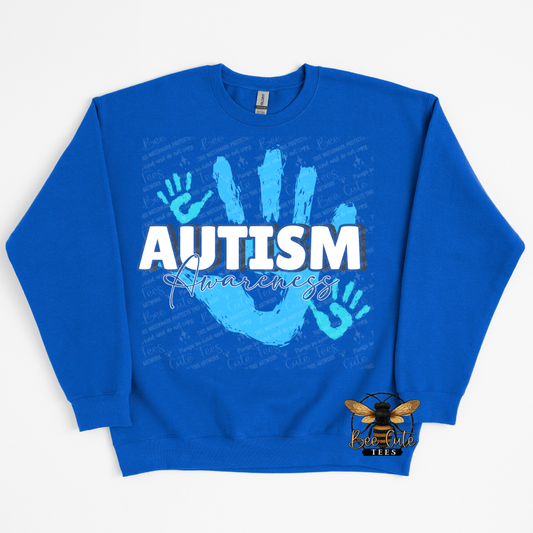Blue sweatshirt with autism awareness design on a white background