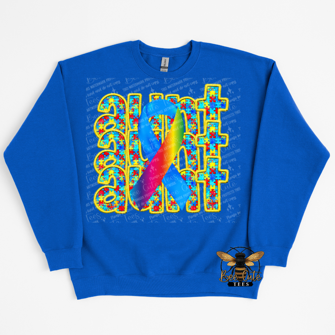Blue sweatshirt with colorful design and text on a white background