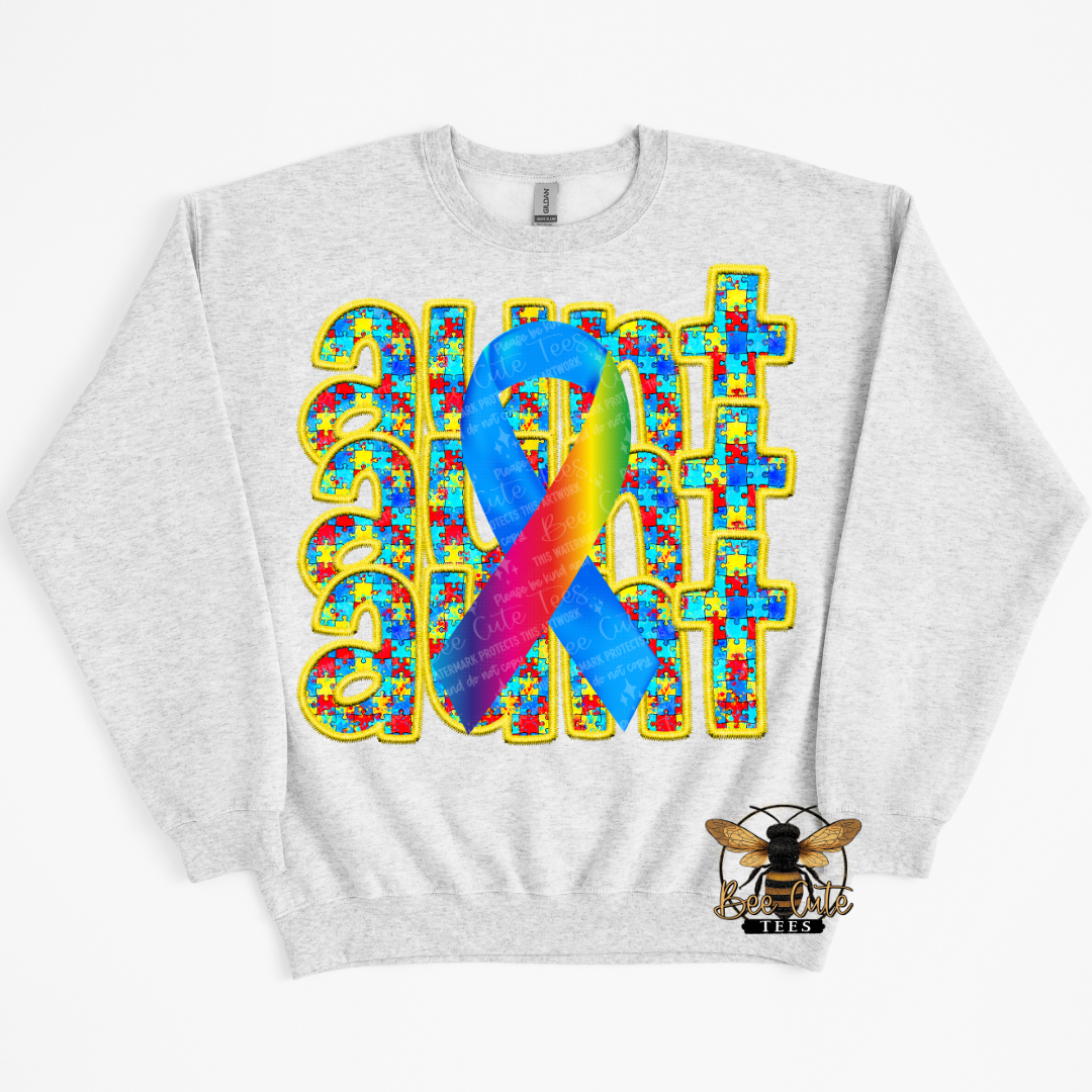 Gray sweatshirt with a colorful ribbon and 'Autism' text design on a white background