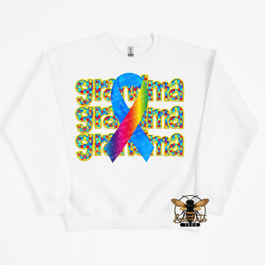 White sweatshirt with colorful rainbow ribbon and 'grandma' text on a white background