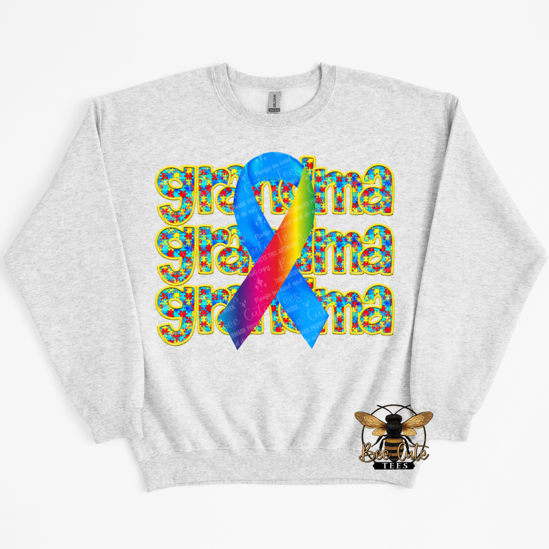 Gray sweatshirt with colorful 'grandma' text and rainbow ribbon design on a white background