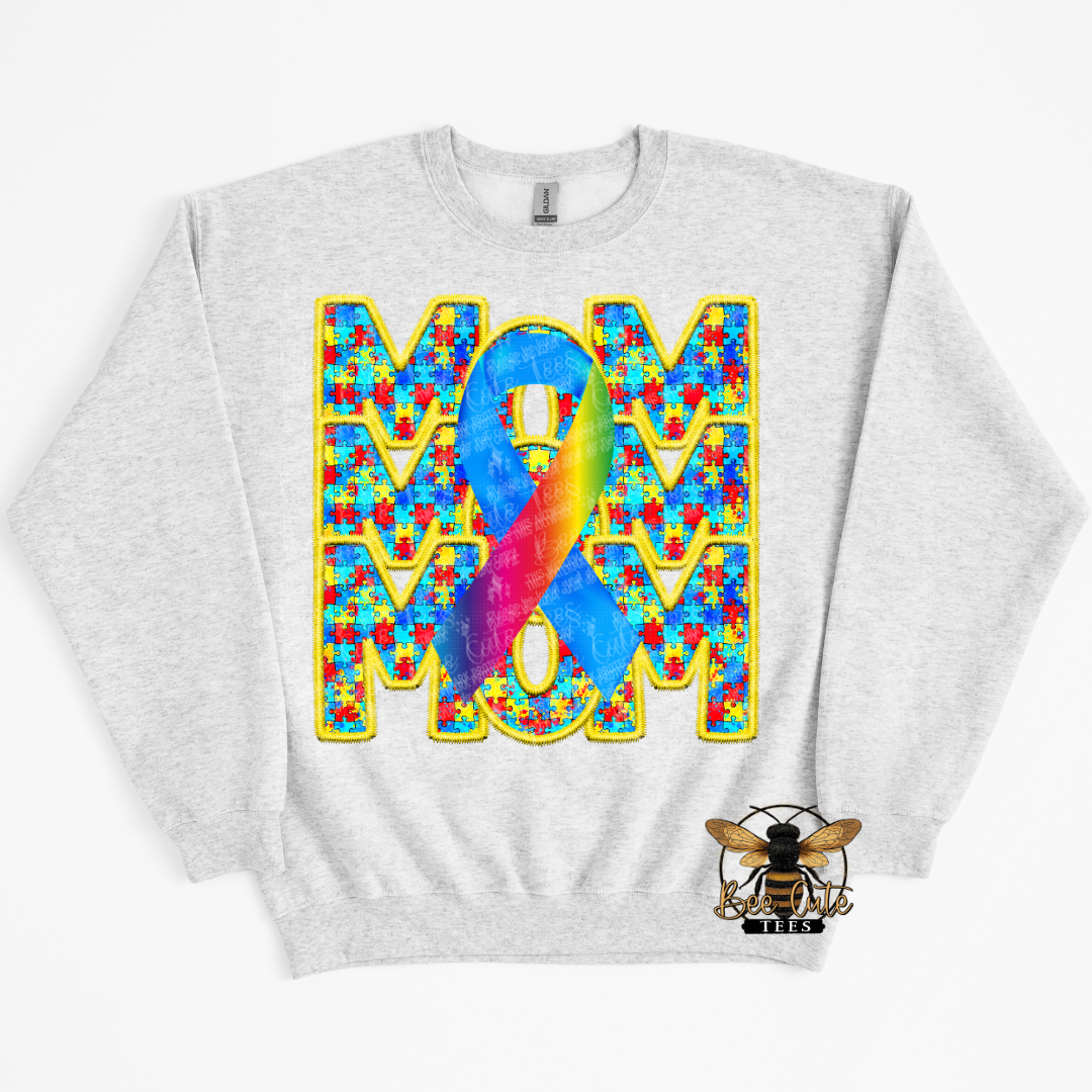 Gray sweatshirt with colorful 'MOM' design featuring a ribbon on a white background