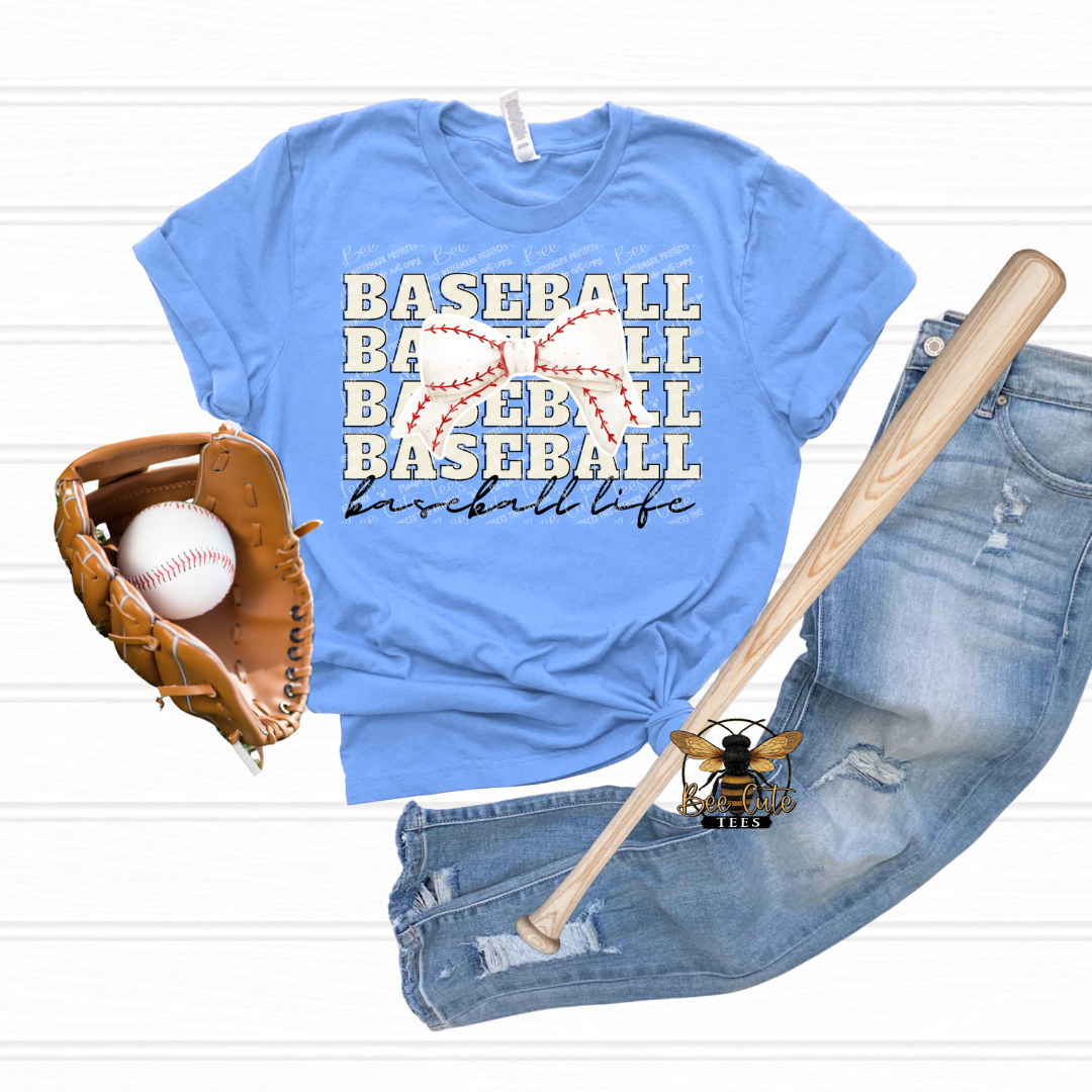 Blue t-shirt with 'Baseball Life' text, baseball glove, bat, and jeans on a white background