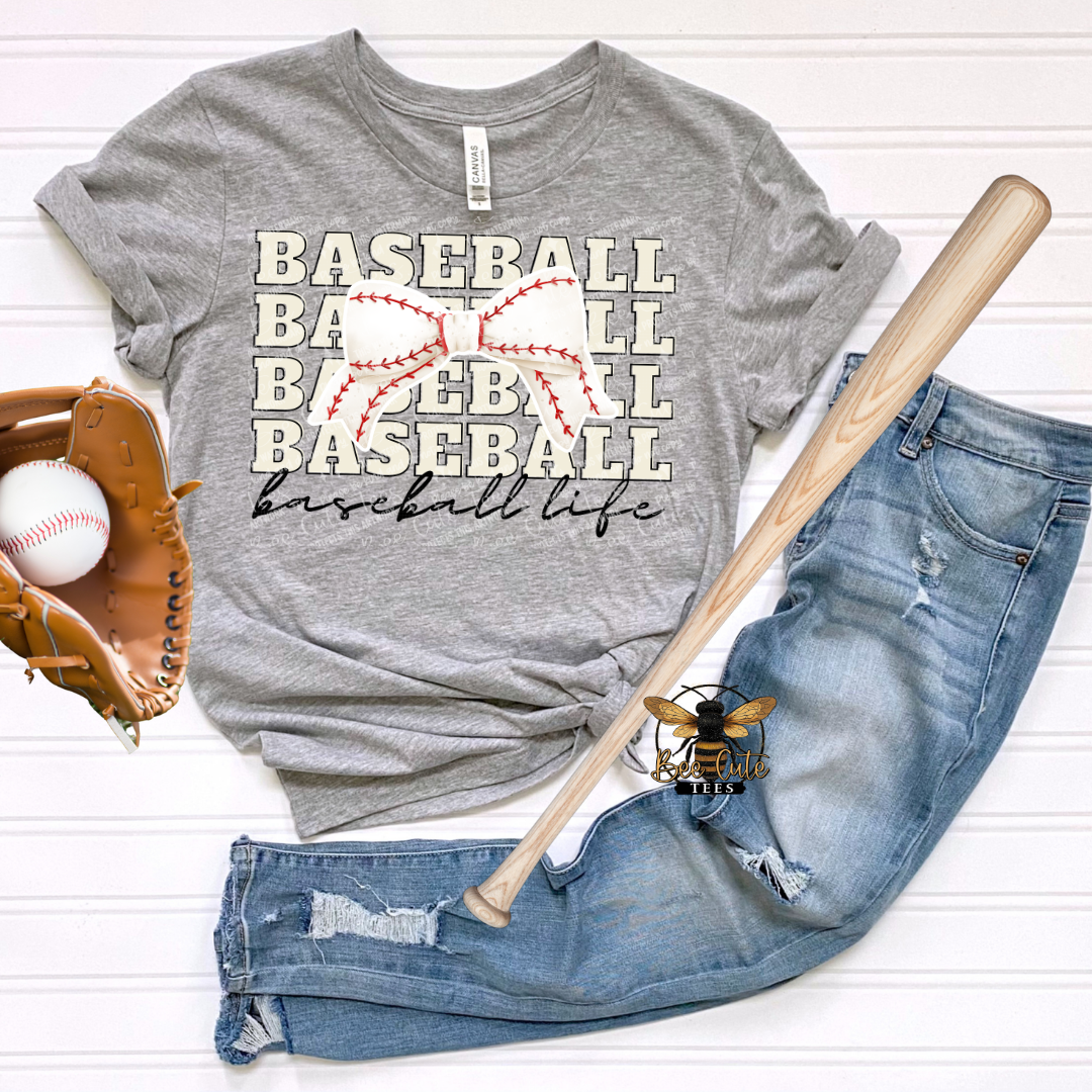 Gray t-shirt with 'BASEBALL LIFE' text, baseball, bat, and jeans on a white background