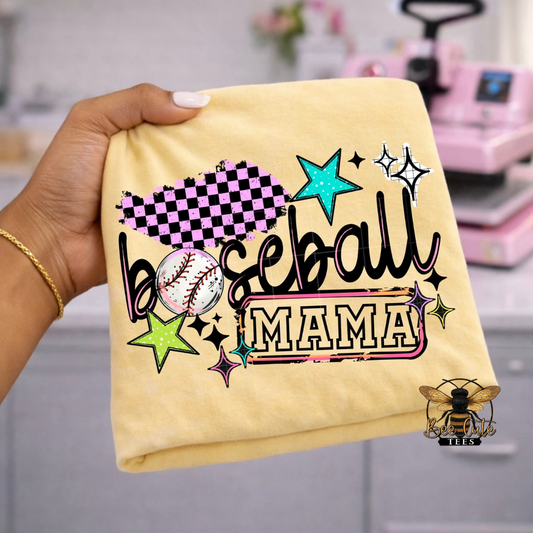 Yellow t-shirt with 'Baseball Mama' text and graphics held by a hand.