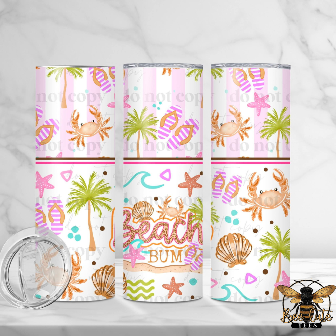 Three tumblers with beach-themed designs on a white background