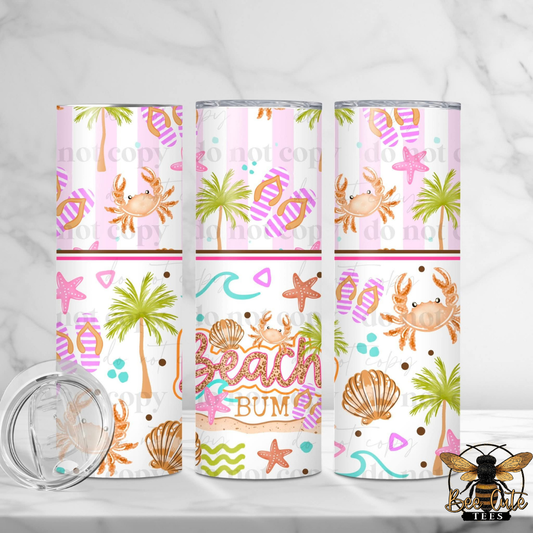Three tumblers with beach-themed designs on a white background