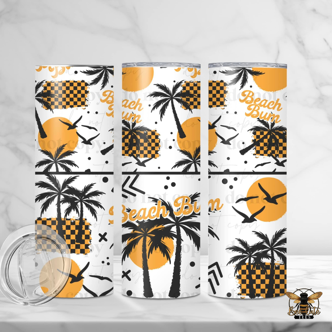 Three tumblers with beach-themed designs on a white background