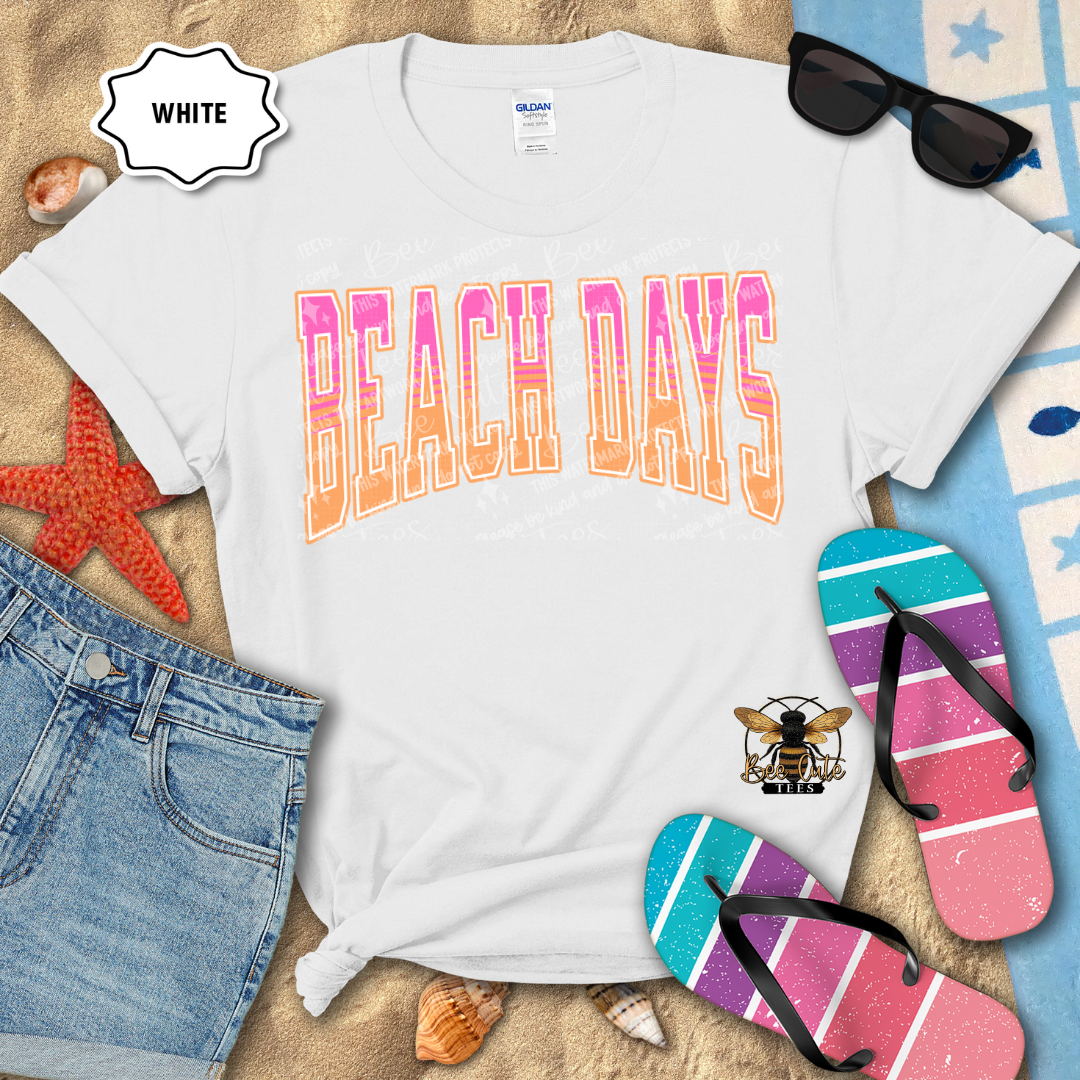 White t-shirt with 'RIVER DAYS' text, sunglasses, denim shorts, and flip-flops on a sandy background