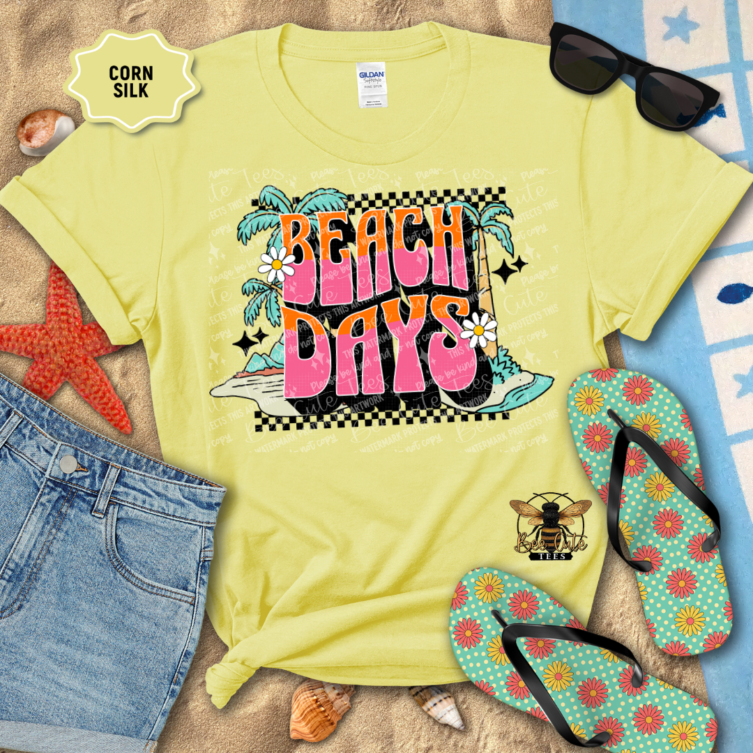 Yellow t-shirt with 'Beach Days' design on a sandy background with flip-flops and sunglasses.