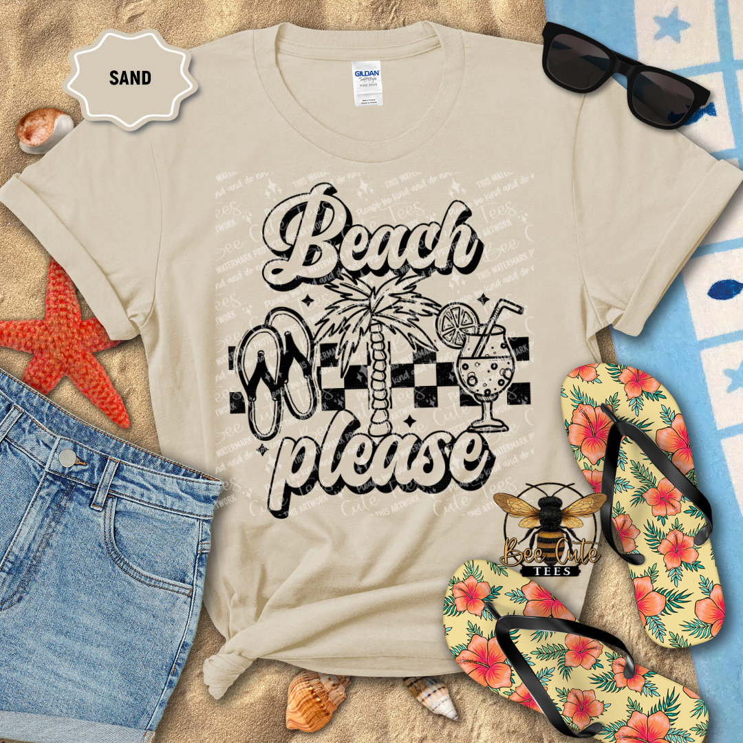 Beige t-shirt with 'Beach Please' design on a sandy background with flip-flops and sunglasses.