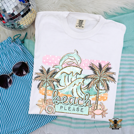 Folded t-shirt with 'Beach Please' design on a striped fabric background