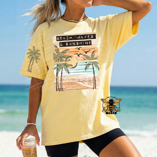 Person wearing a yellow t-shirt with a beach graphic on a beach background