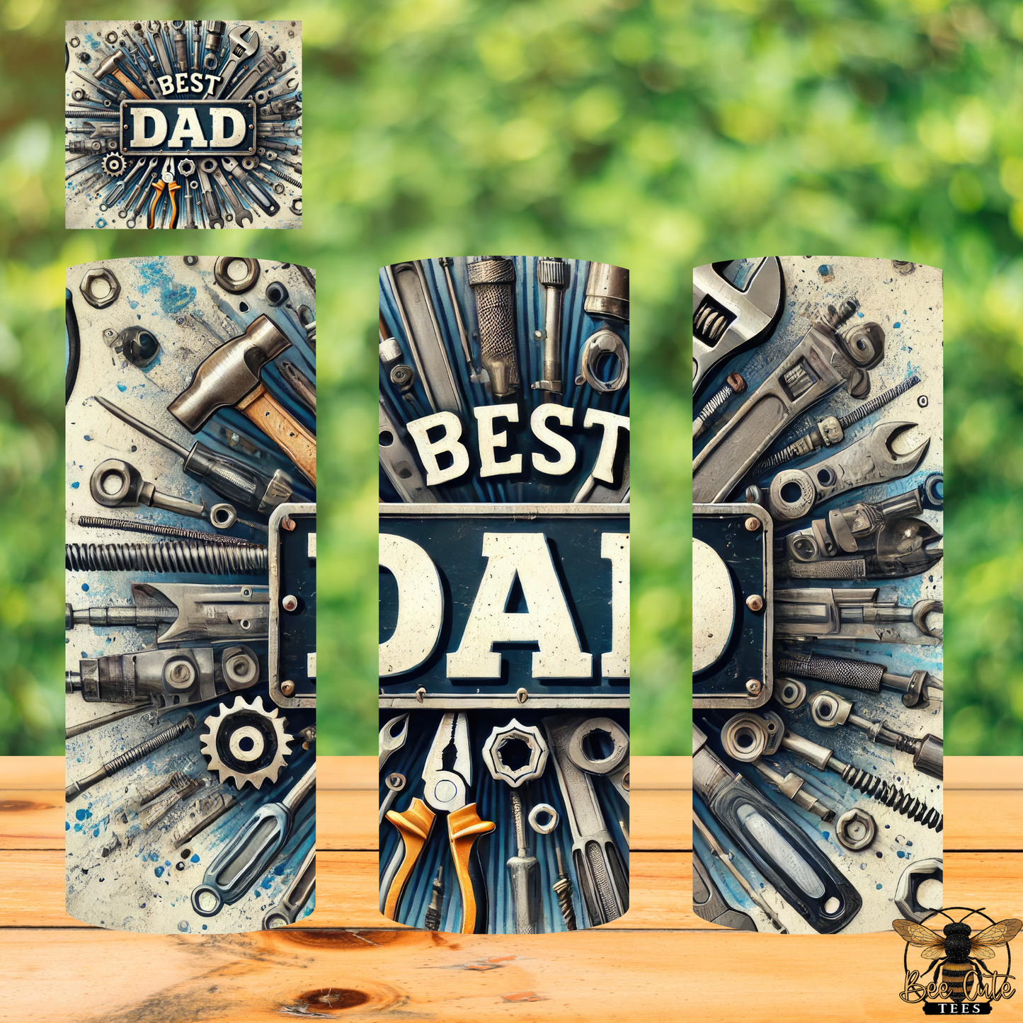 Decorative tumblers with tools and 'Best Dad' text on a wooden surface with green blurred background