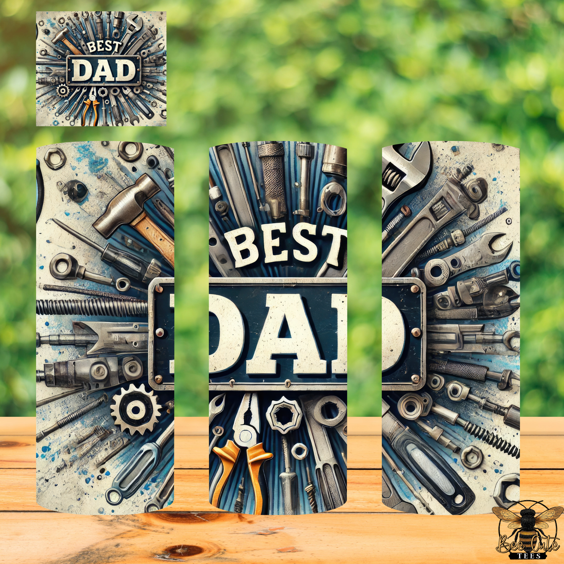 Decorative tumblers with tools and 'Best Dad' text on a wooden surface with green blurred background