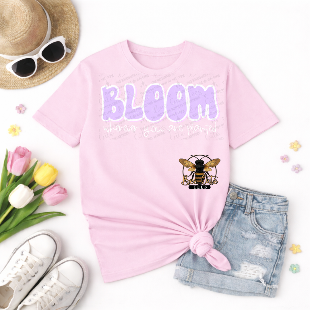 Pink t-shirt with 'BLOOM' and bee logo, sunglasses, tulips, and shorts on a white background