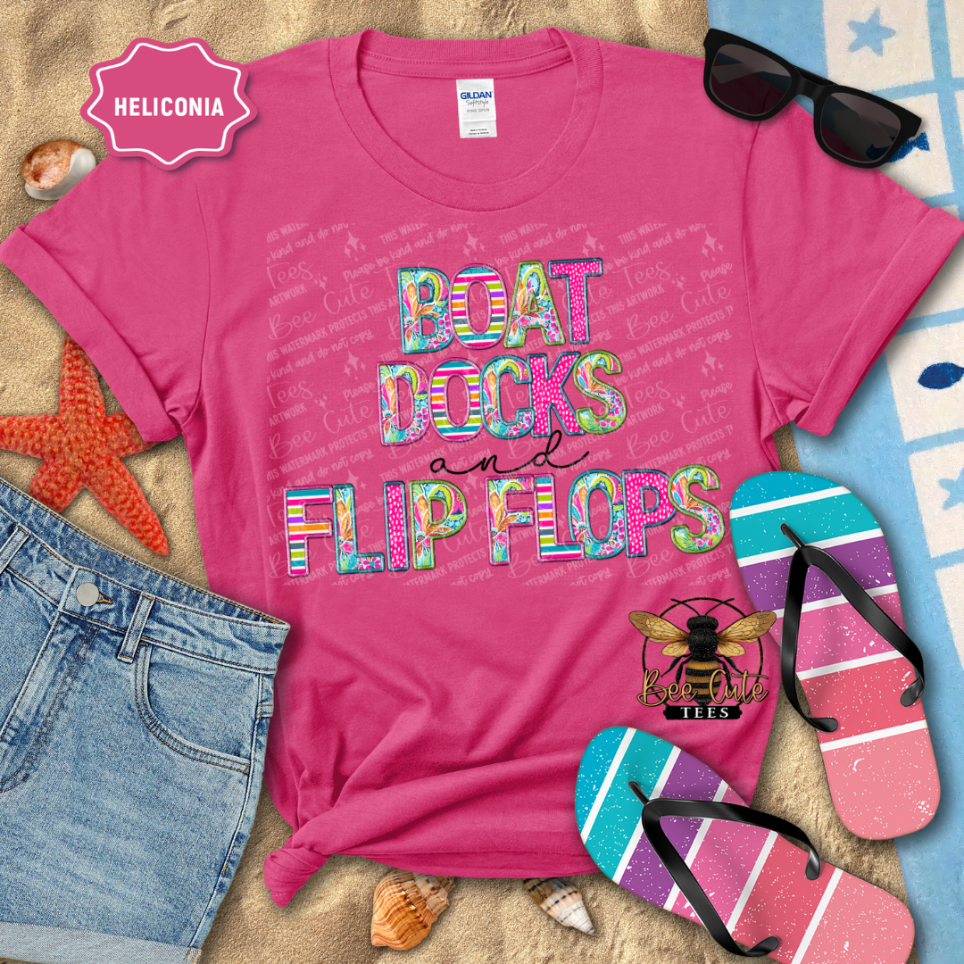 Pink t-shirt with 'Boat Docks and Flip Flops' text, sunglasses, and flip-flops on a beach-themed background.